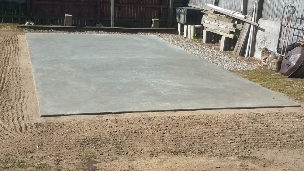 Concrete slab pad installed in a backyard by South Jersey Construction Enterprise
